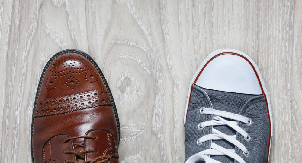 Dress and casual shoe on wood floor