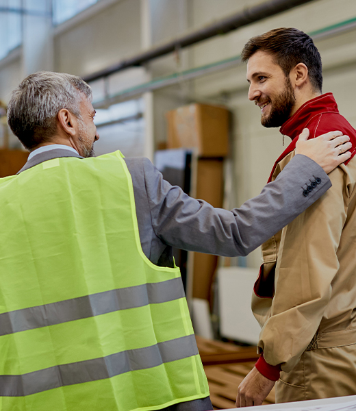 Therapist congratulating warehouse employee