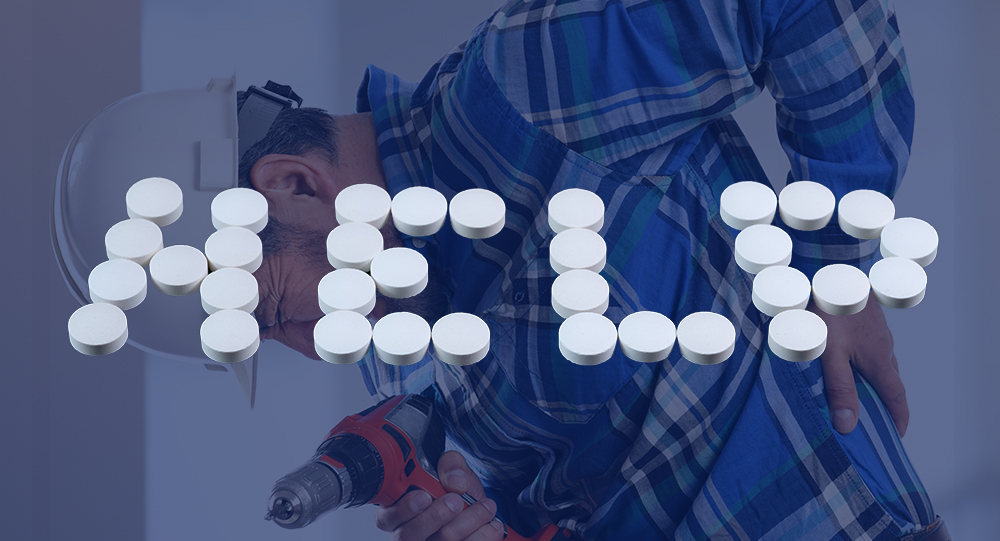 Injured worker holding a drill with help spelt in opioids